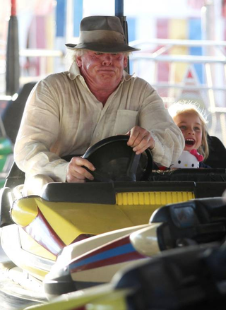 Illustration for article titled It's Friday, so here are photos of Gary Busey on a roller coaster and Nick Nolte riding a bumper car